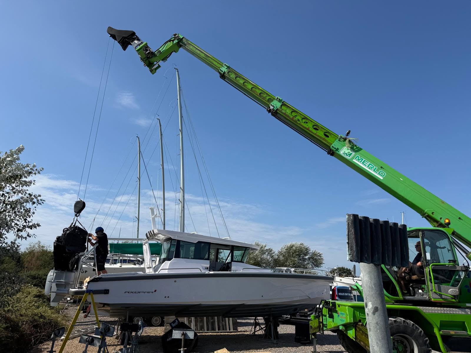 Marine engineer completing Mercury outboard servicing in Poole